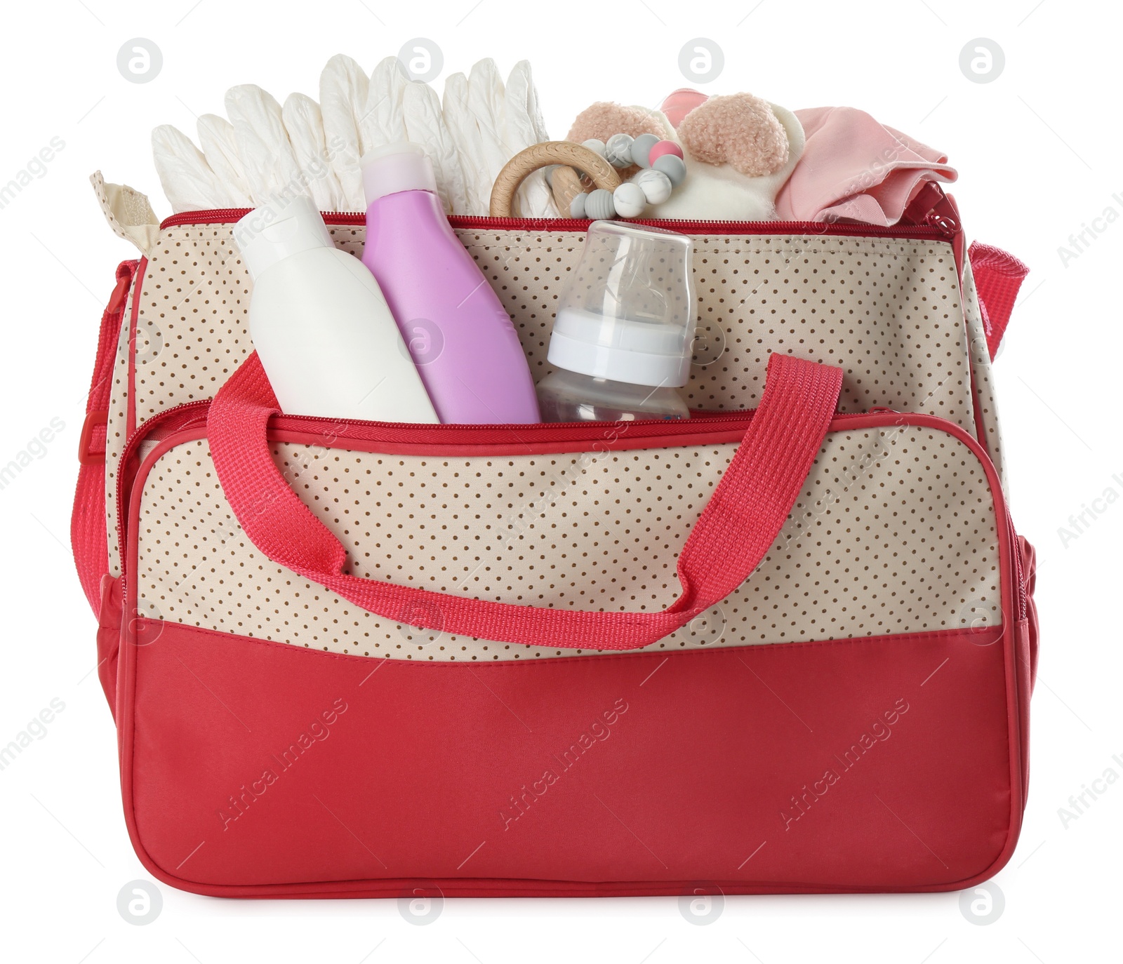Photo of Mother's bag with baby's stuff isolated on white