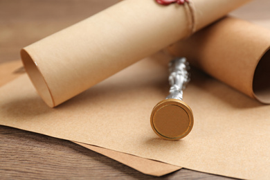 Photo of Notary's public pen and documents on wooden table, closeup