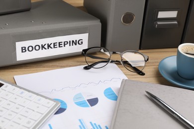 Bookkeeper's workplace with folders and documents on table