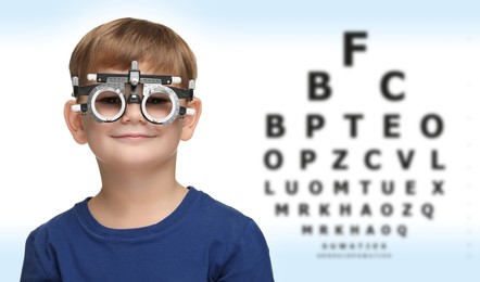 Image of Vision test. Little boy with trial frame and eye chart on gradient background. Banner design