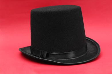 One magician top hat on red background