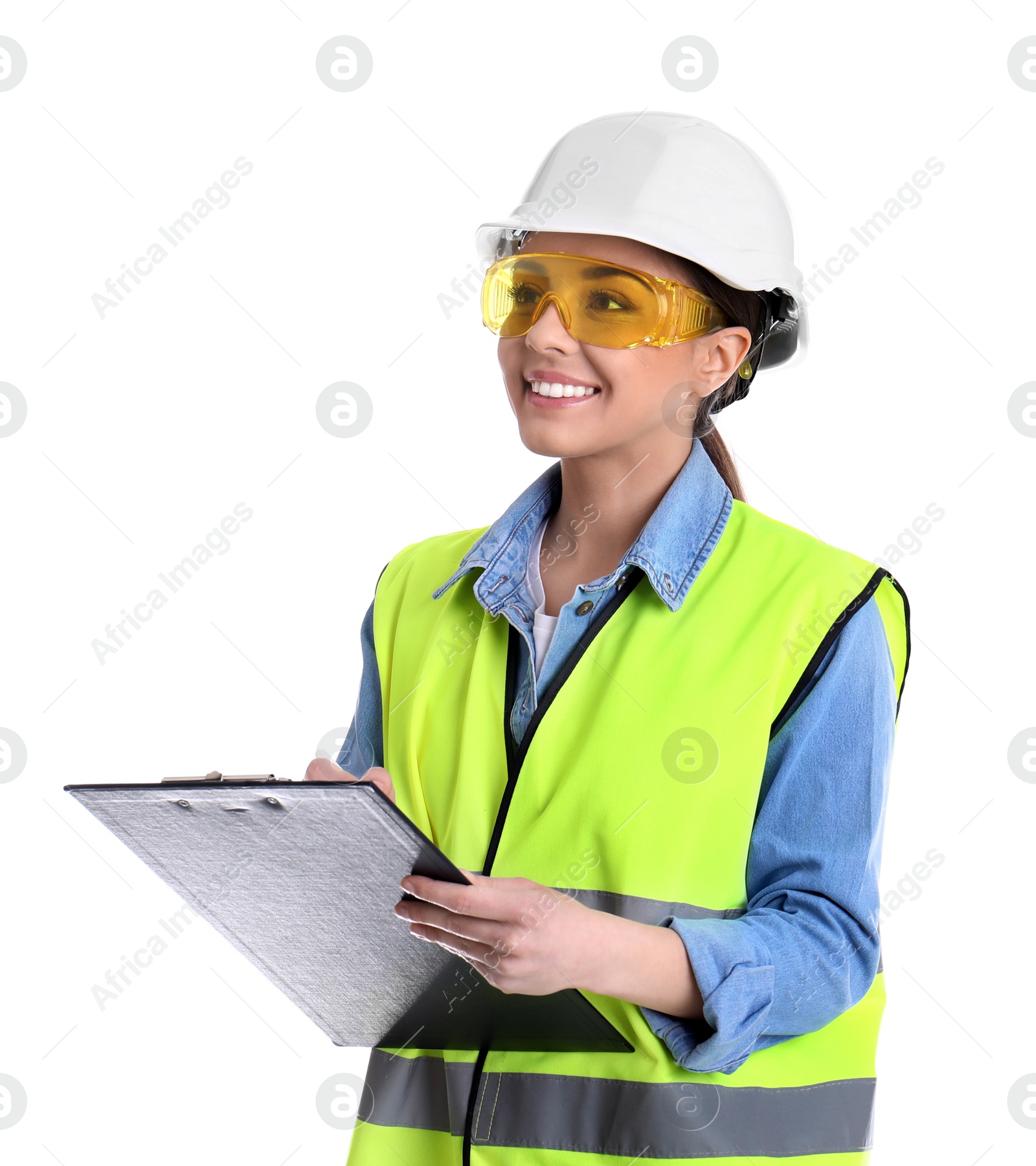 Photo of Female industrial engineer in uniform with clipboard on white background. Safety equipment