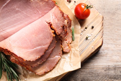 Photo of Delicious ham on wooden table, closeup. Christmas dinner