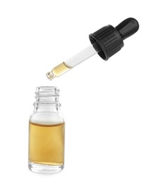 Photo of Little bottle with essential oil and dropper on white background