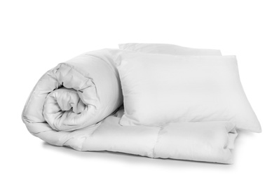 Photo of Clean blanket and pillows on white background