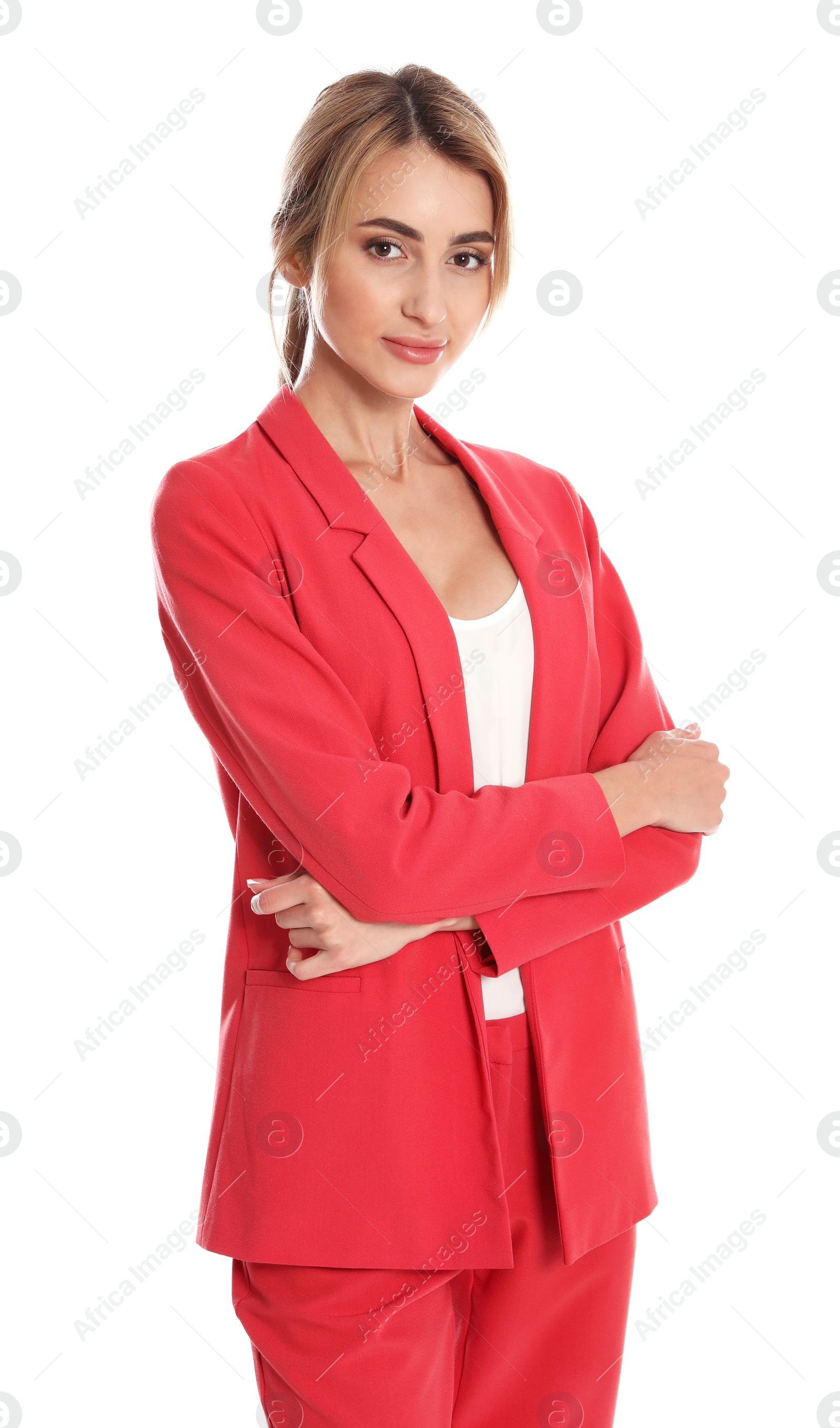 Photo of Beautiful young woman in red suit posing on white background