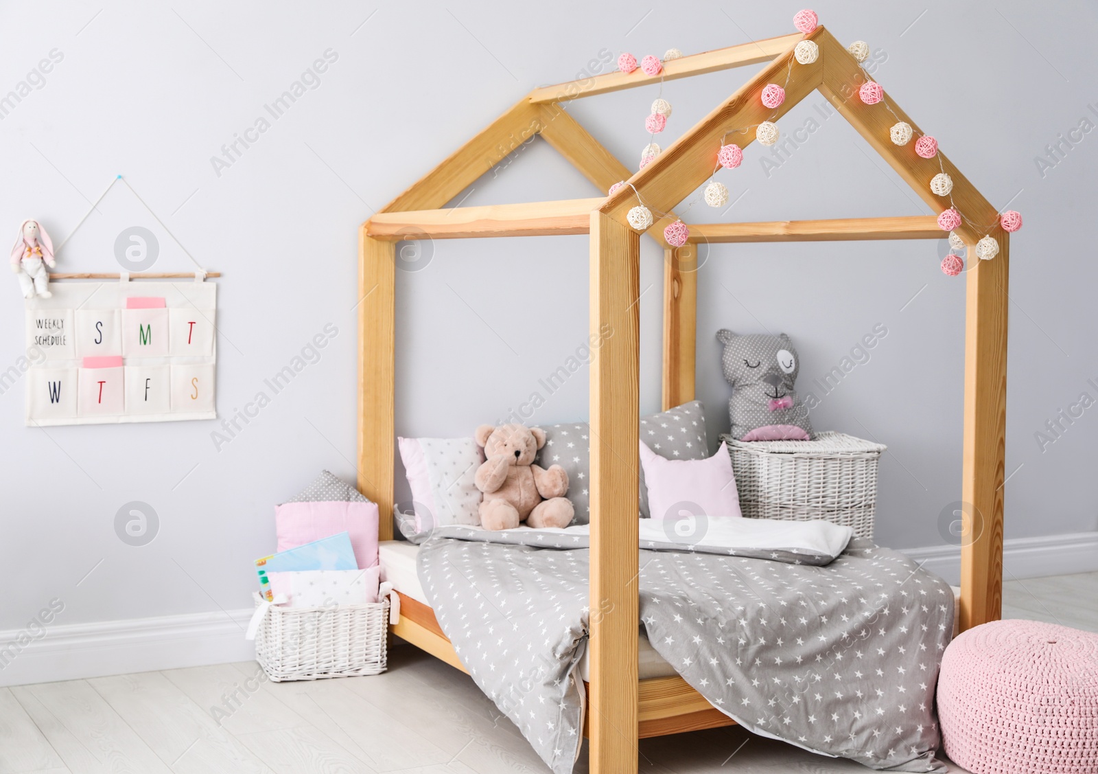 Photo of Stylish child room interior with comfortable bed