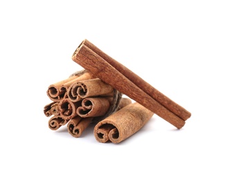 Photo of Aromatic cinnamon sticks on white background