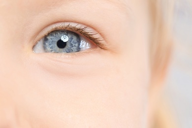 Photo of Little girl, focus on eye. Visiting children's doctor and ophthalmologist