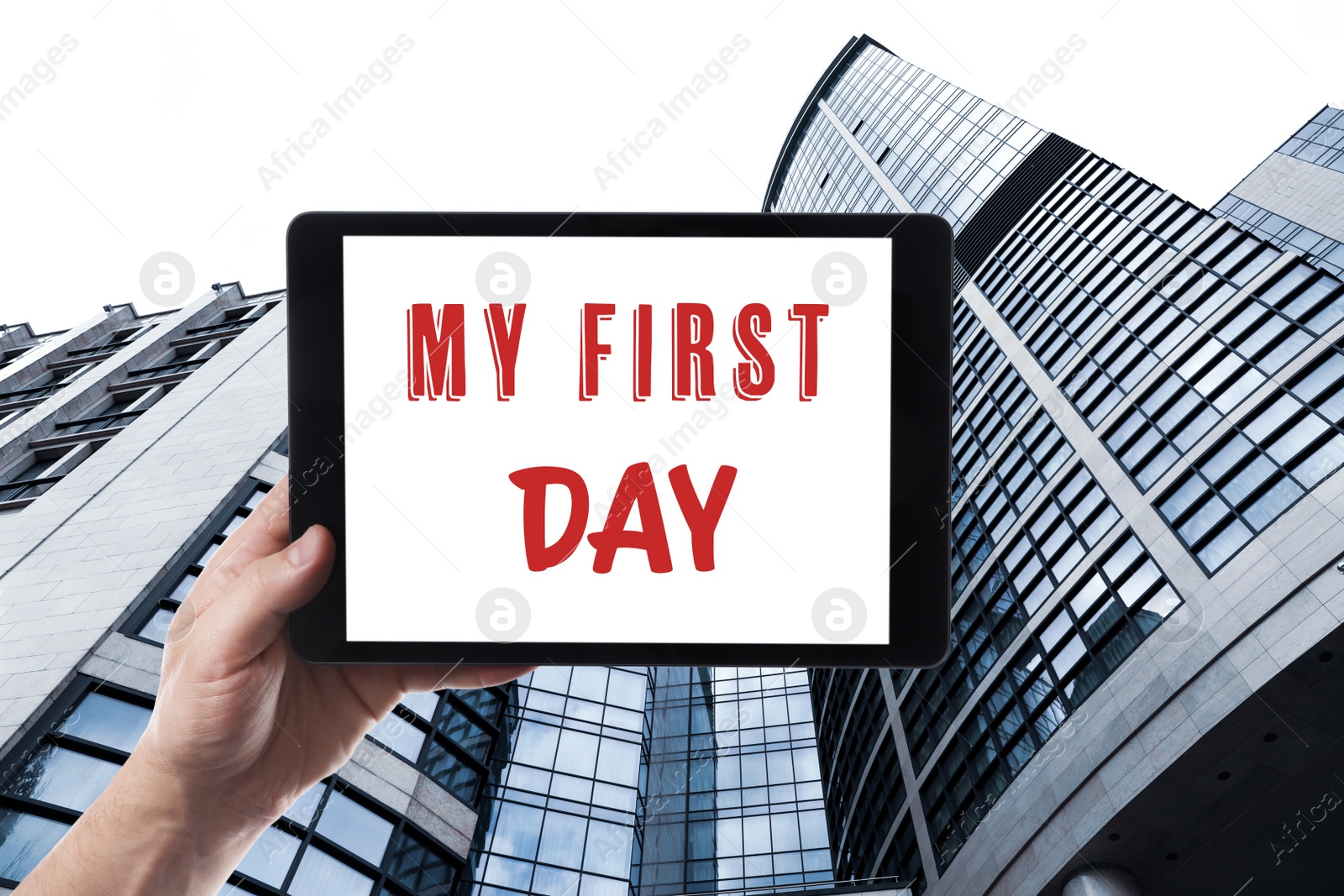 Image of Start new job. Man holding tablet with text My First Day against modern building, closeup