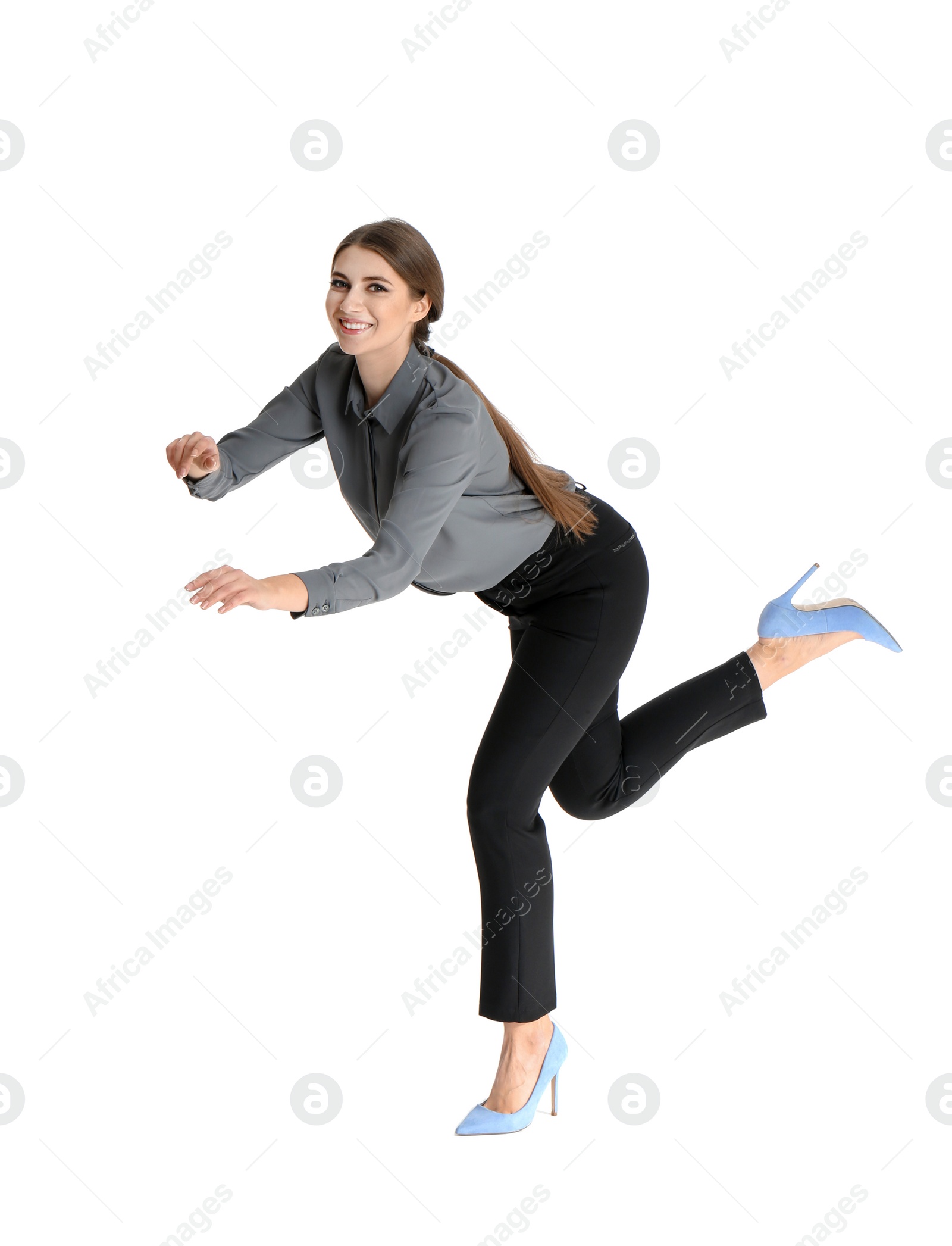 Photo of Young woman attracted to magnet on white background