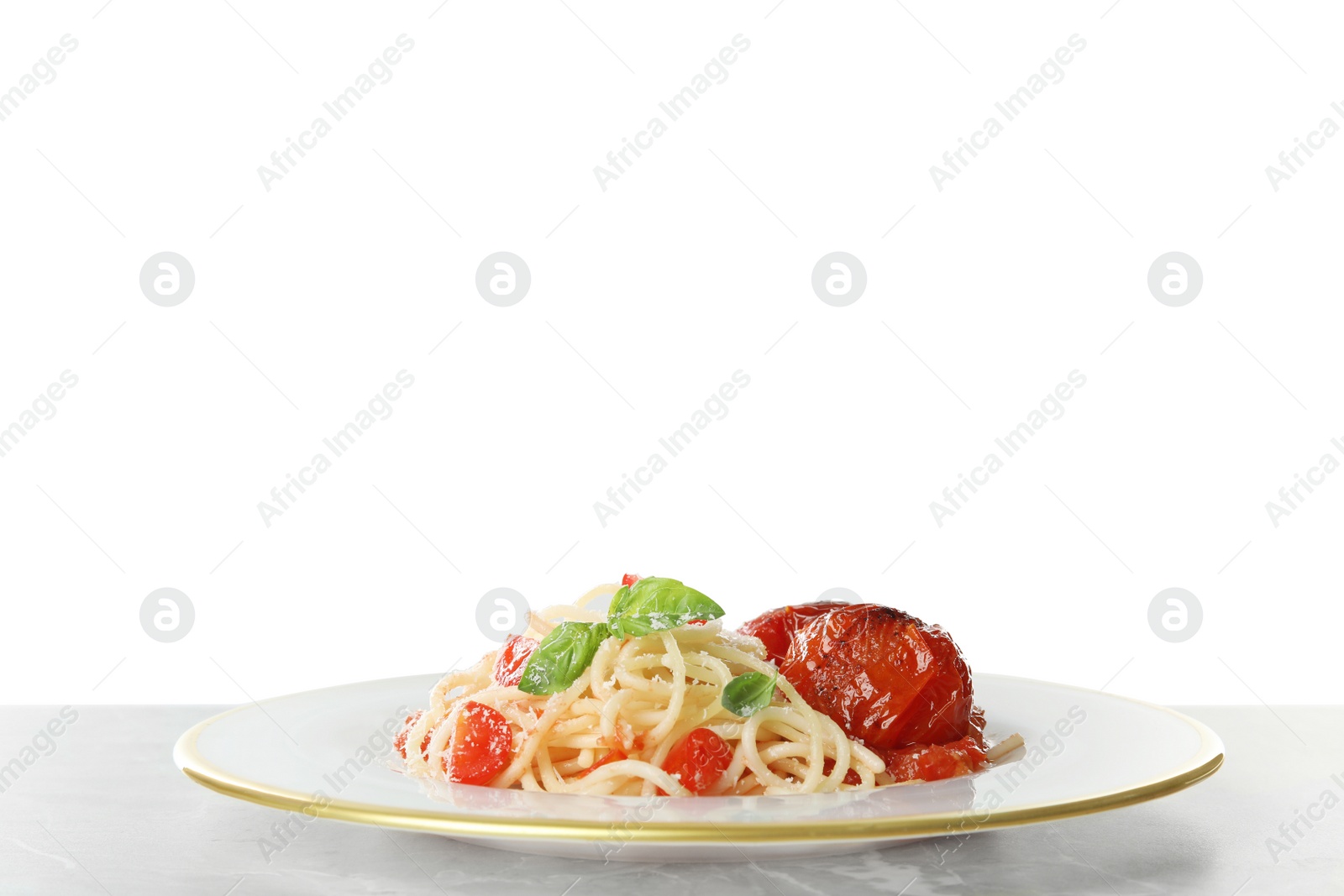 Photo of Tasty pasta on light grey marble table against white background