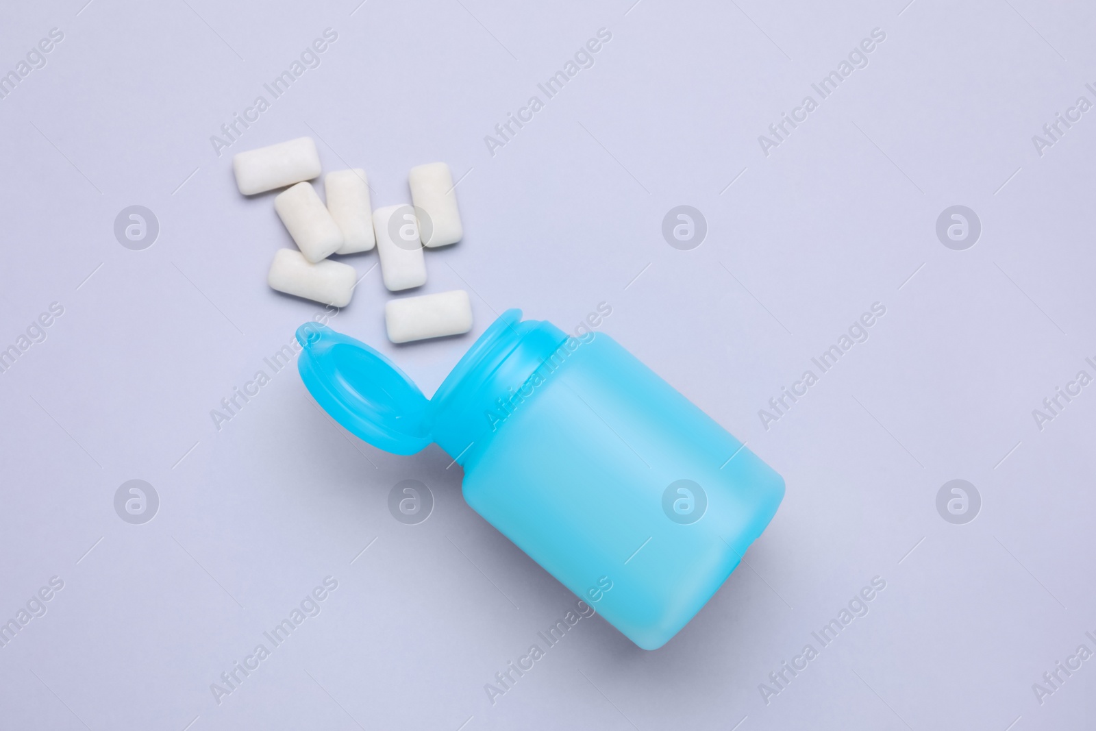 Photo of Jar with chewing gums on light grey background, flat lay