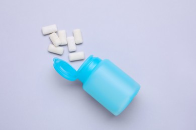 Photo of Jar with chewing gums on light grey background, flat lay