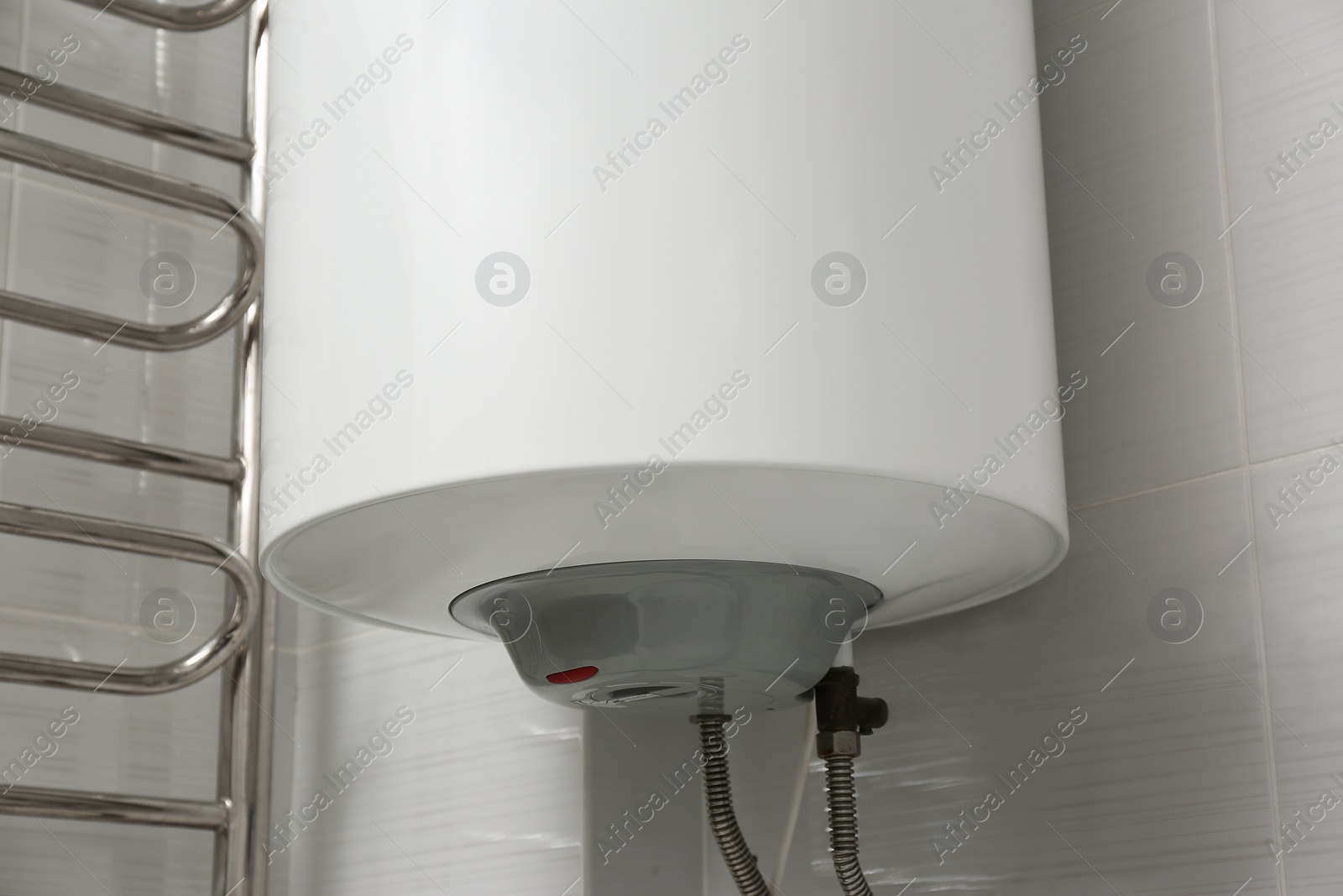 Photo of White boiler with maximum energy efficiency indicator indoors