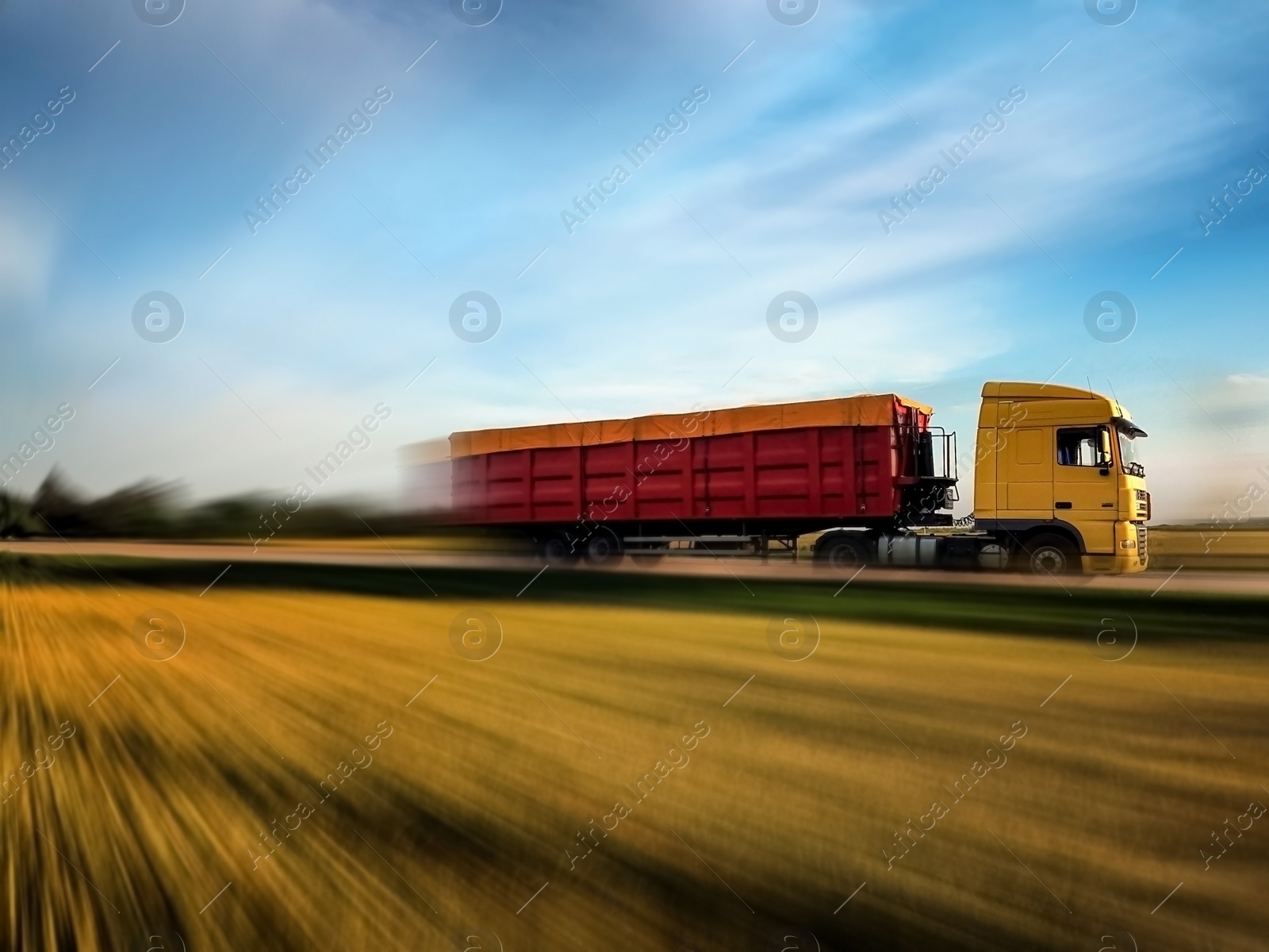 Image of Logistics concept. Truck on country road, motion blur effect 