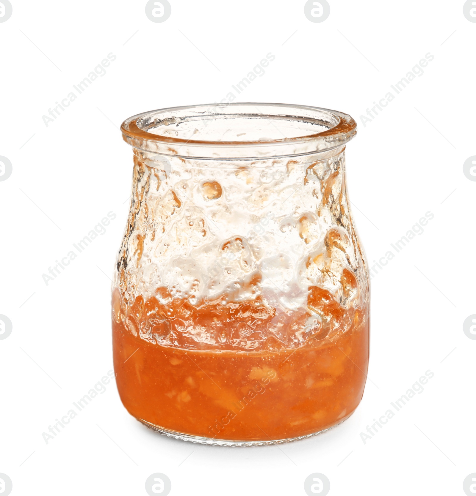 Photo of Jar with leftovers of tasty sweet jam on white background