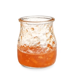 Photo of Jar with leftovers of tasty sweet jam on white background