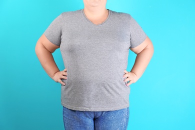 Overweight woman before weight loss on color background