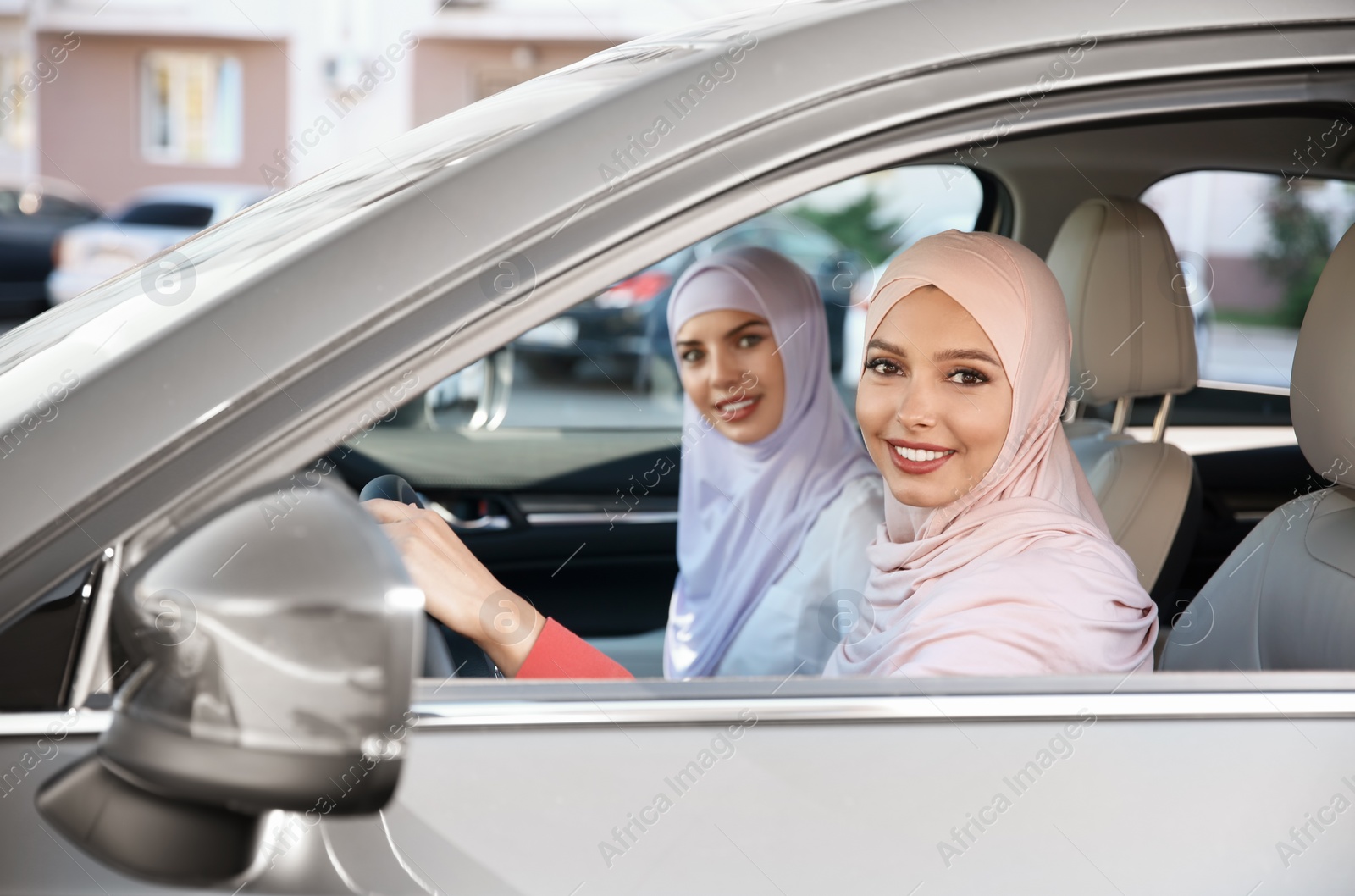 Photo of Female Muslim driver and her friend in car