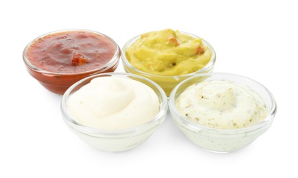 Many different sauces in bowls on white background