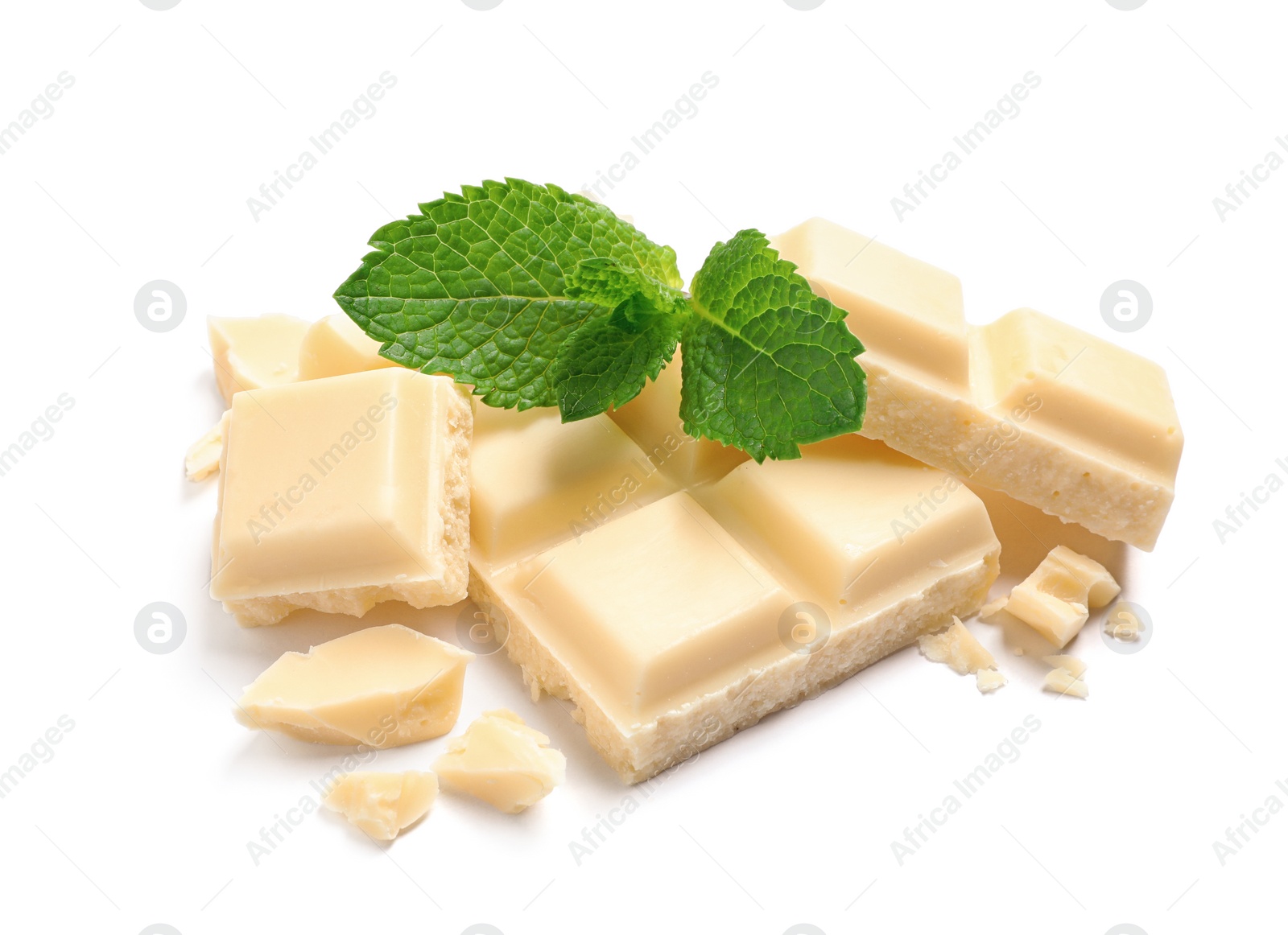 Photo of Pieces of white chocolate with mint on white background