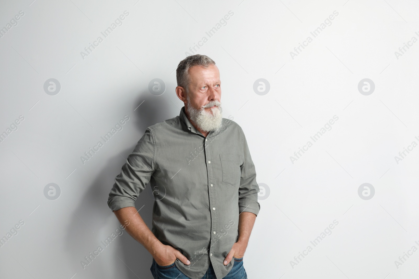 Photo of Portrait of handsome senior man on white background