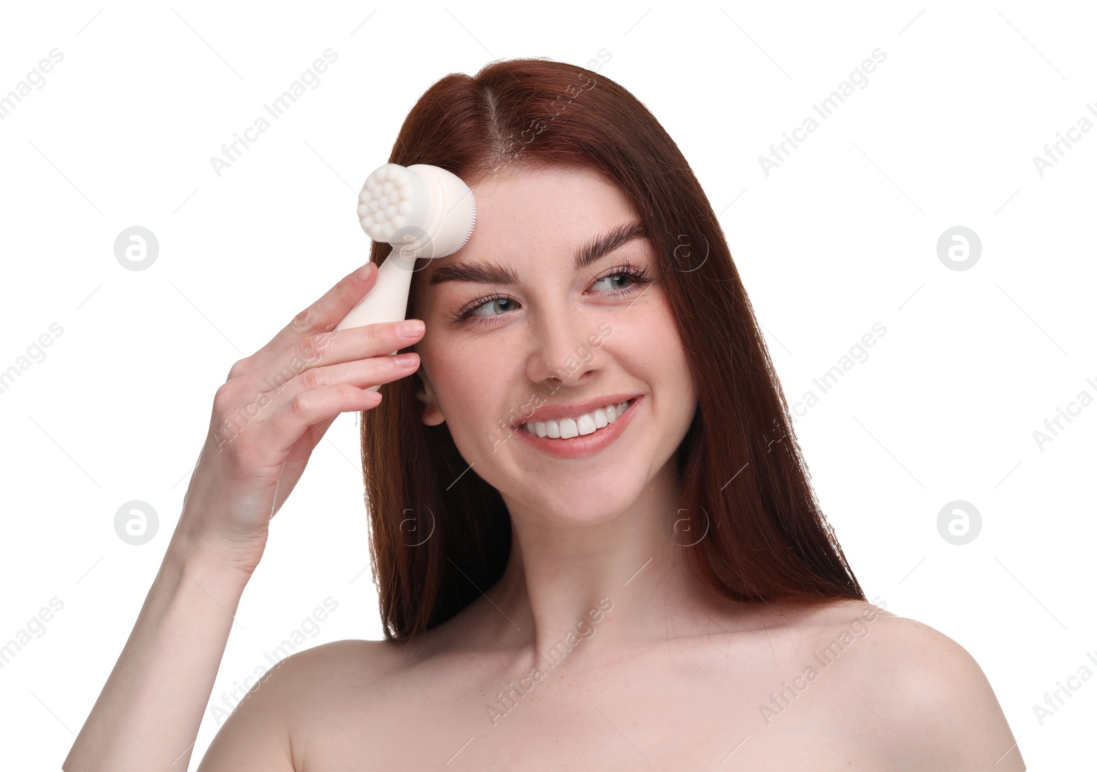 Photo of Washing face. Young woman with cleansing brush on white background