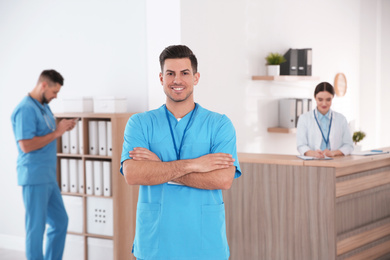 Photo of Portrait of male doctor in modern clinic