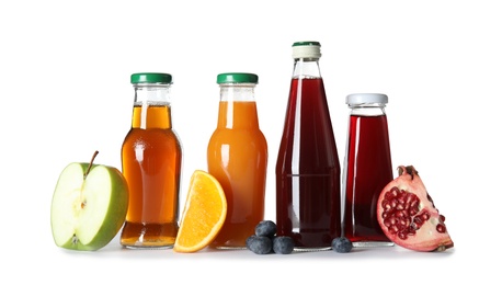 Photo of Bottles with different drinks and ingredients on white background