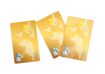 Golden plastic credit cards on white background
