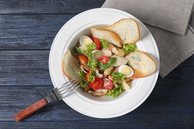 Photo of Plate with delicious fresh salad on table, top view