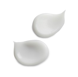 Photo of Samples of facial cream on white background, top view