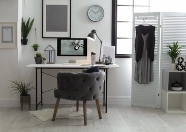 Photo of Stylish workplace with modern computer on desk