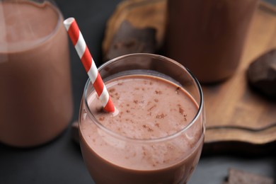 Photo of Delicious chocolate milk in glass, closeup view
