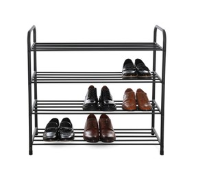 Photo of Stylish shelving unit with different pairs of shoes on white background. Storage idea