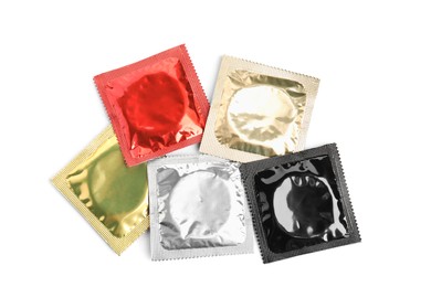 Photo of Condom packages on white background, top view. Safe sex