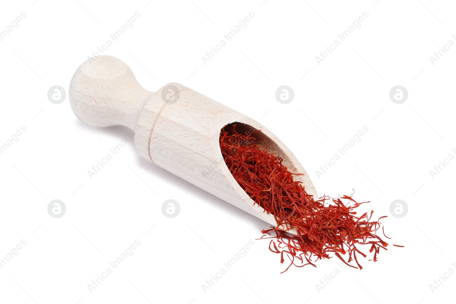 Photo of Aromatic saffron and scoop isolated on white