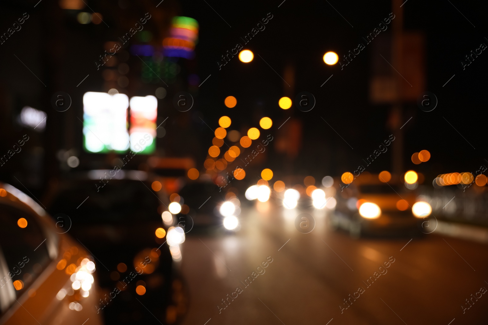 Photo of Blurred view of cityscape with bokeh effect. Night life