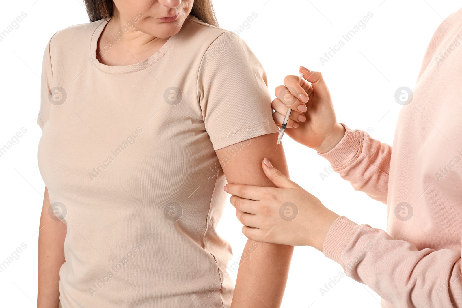 Photo of Diabetes. Woman getting insulin injection on white background, closeup