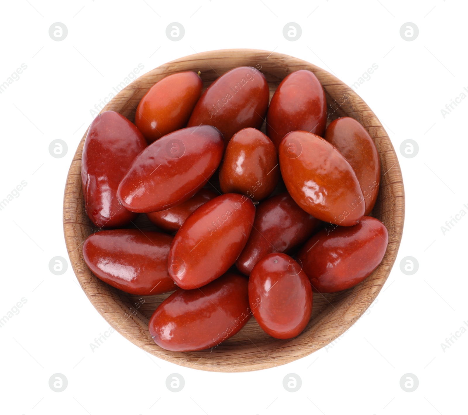 Photo of Wooden bowl of ripe red dates on white background, top view