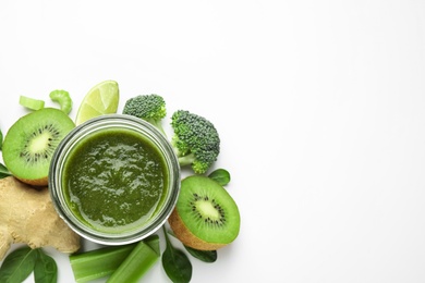 Photo of Delicious green juice and fresh ingredients on white background, top view