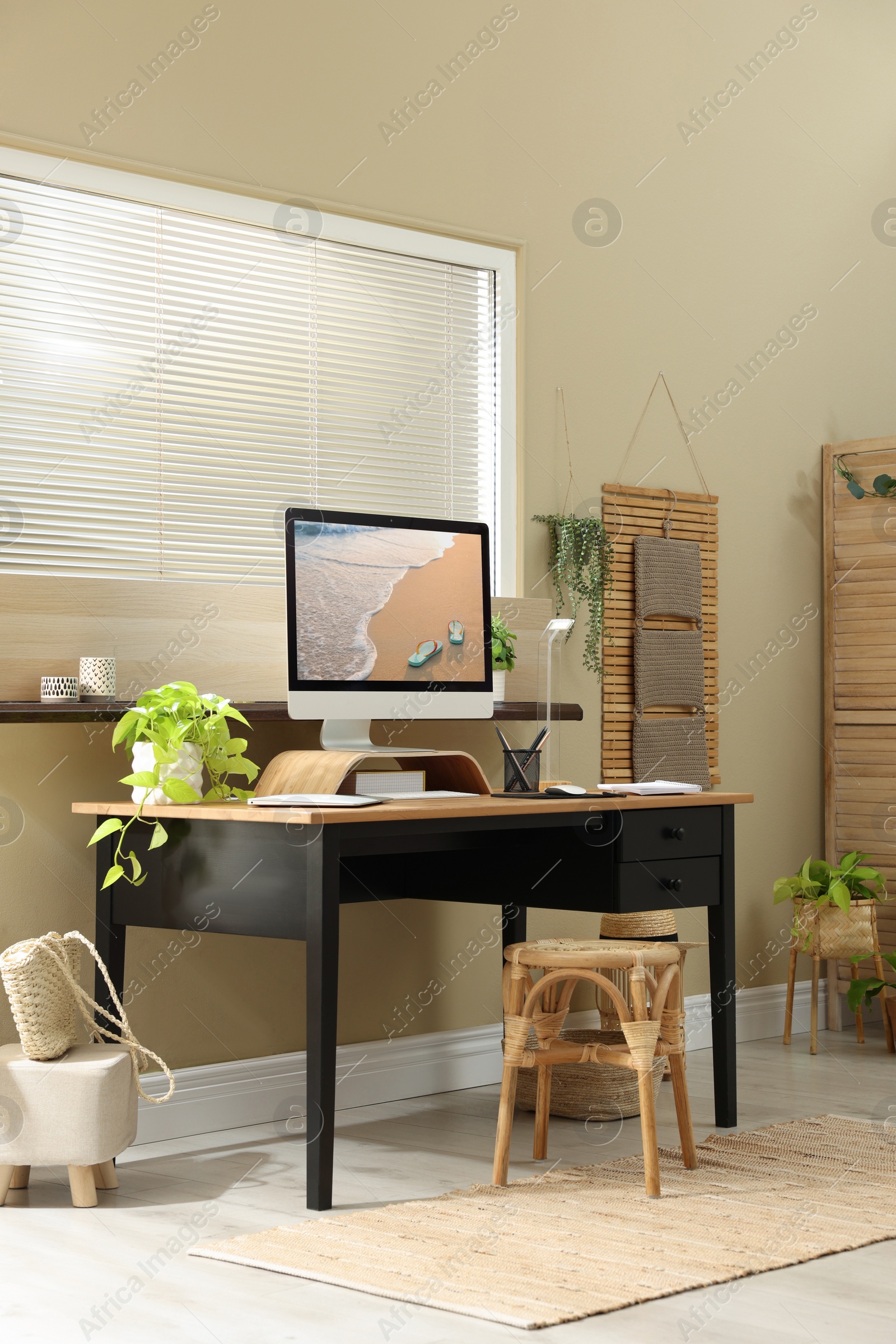 Photo of Light room interior with comfortable workplace near window