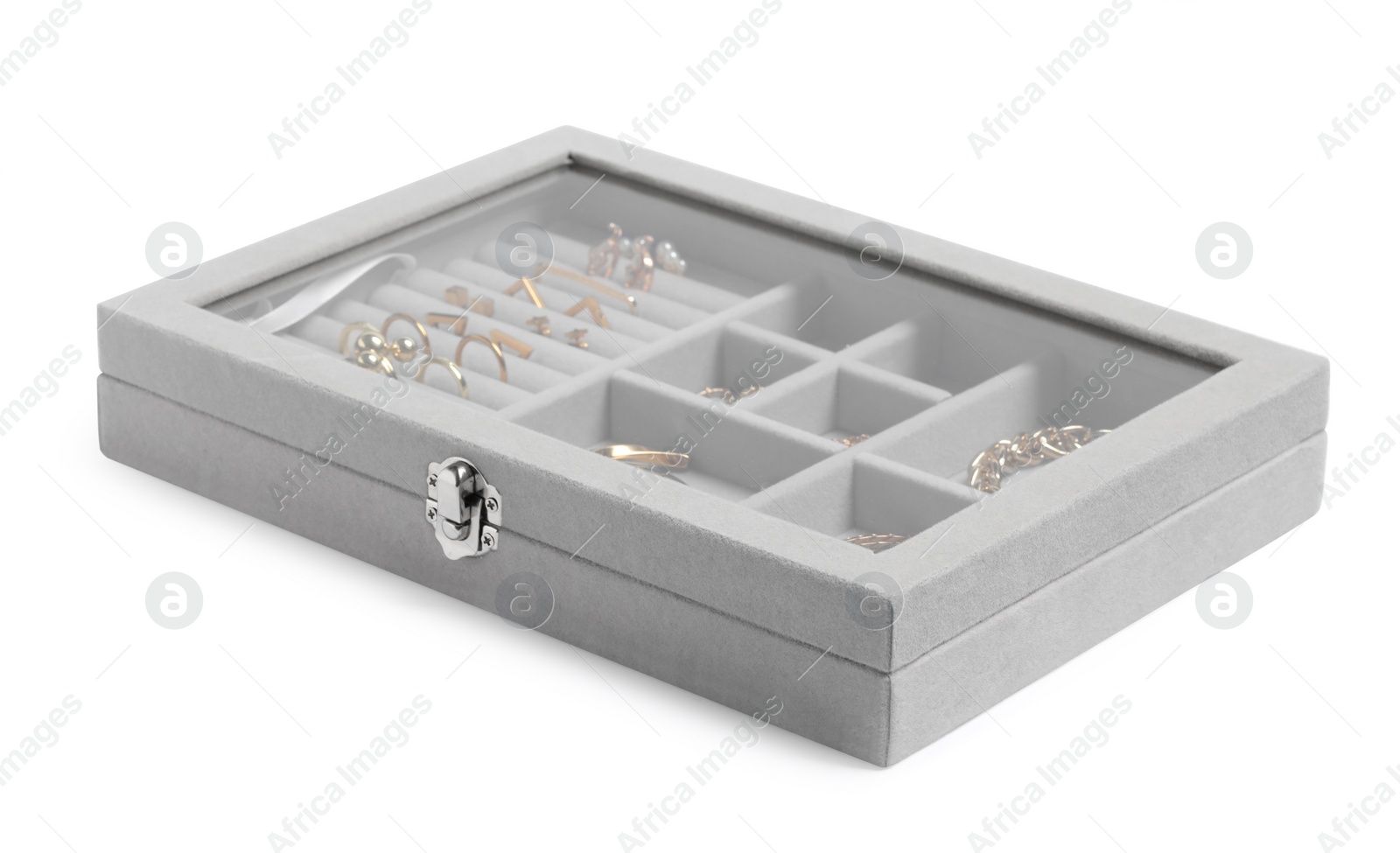 Photo of Jewelry box with many different golden accessories isolated on white