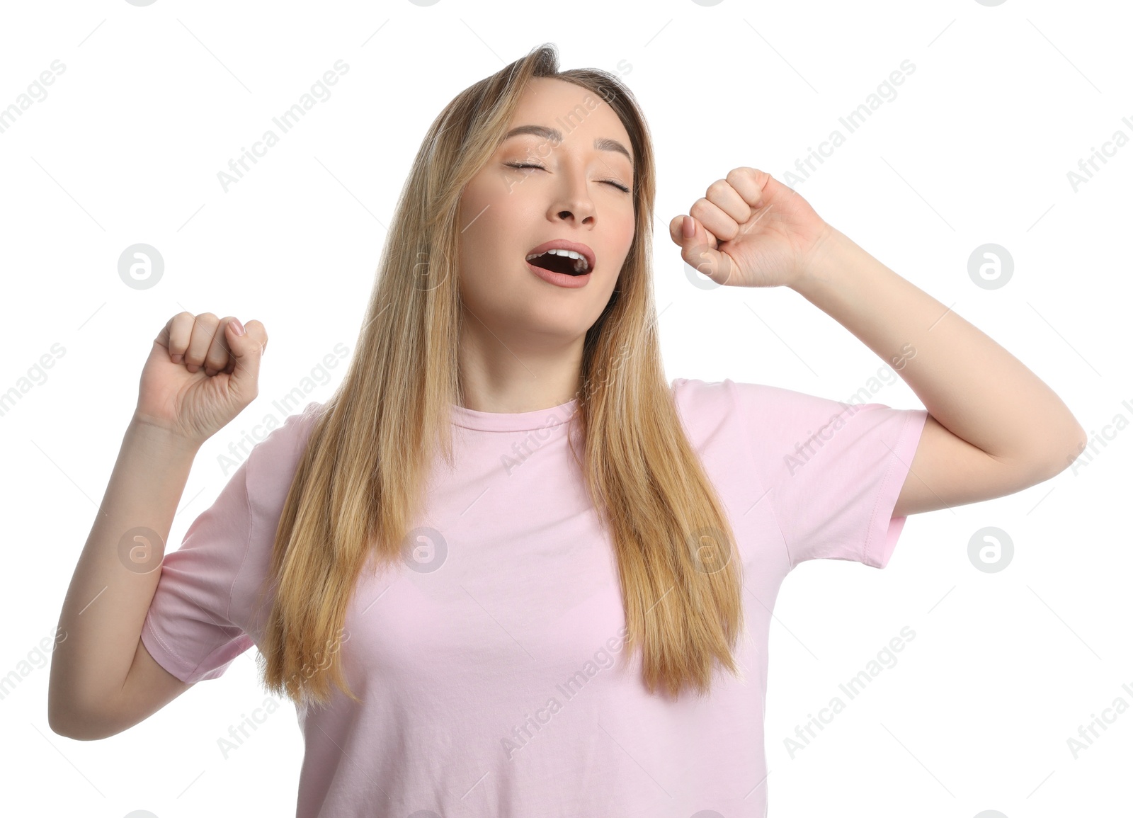 Photo of Young tired woman yawning on white background