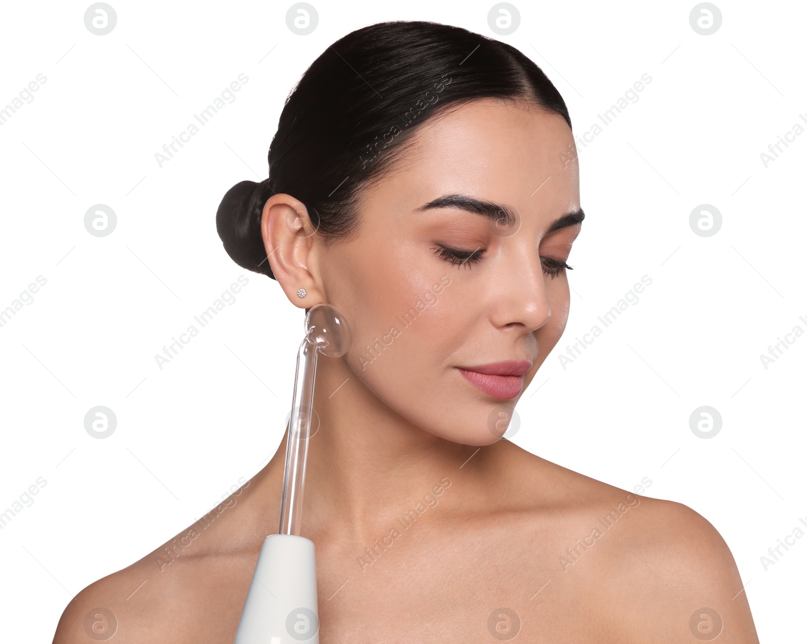 Photo of Woman using high frequency darsonval device on white background