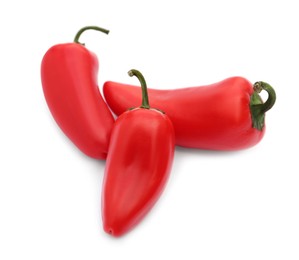 Photo of Fresh raw red hot chili peppers on white background