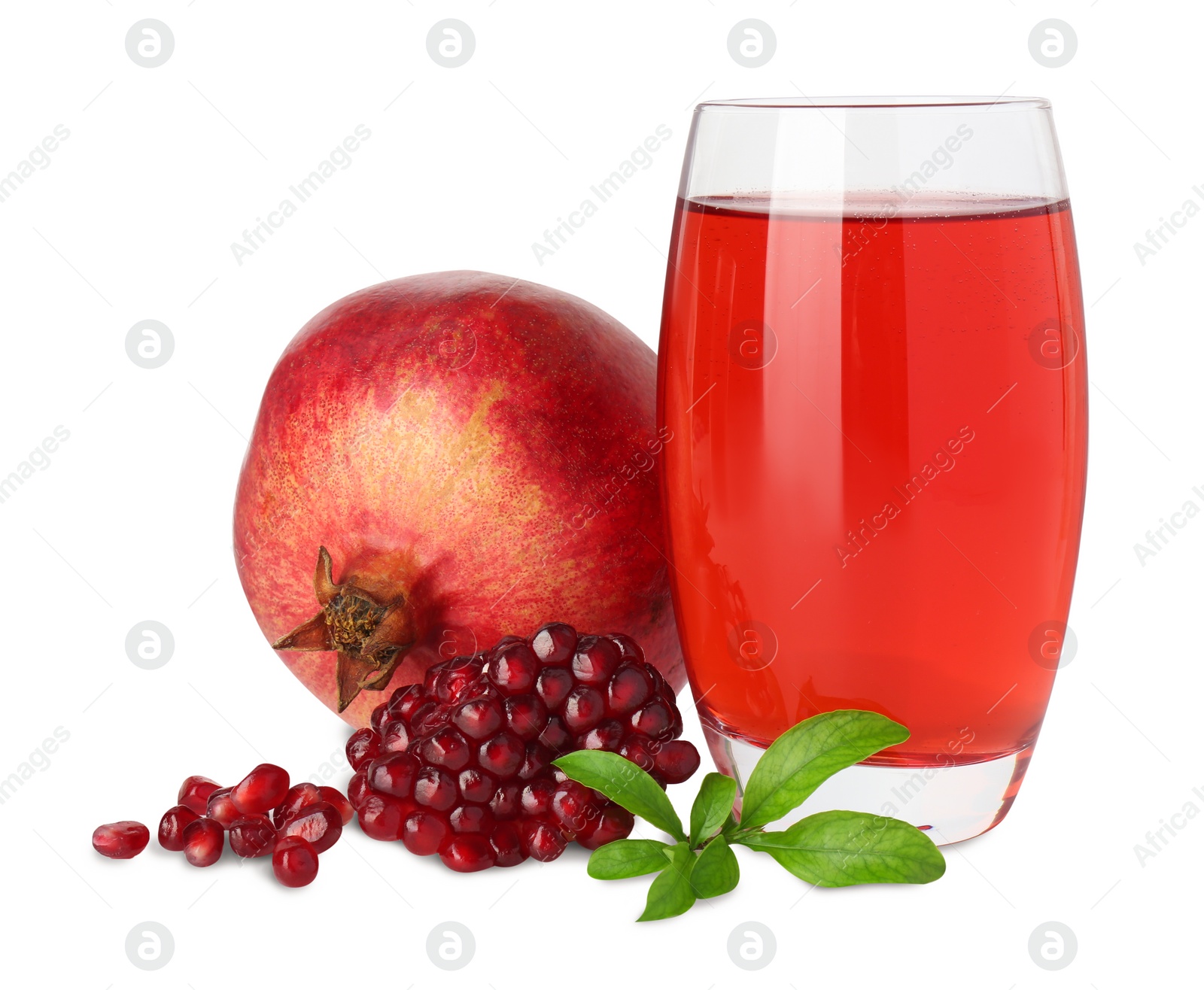 Photo of Refreshing pomegranate juice in glass, leaves, seeds and fruit isolated on white