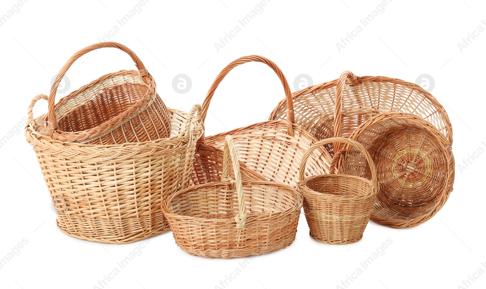 Photo of Many different wicker baskets on white background