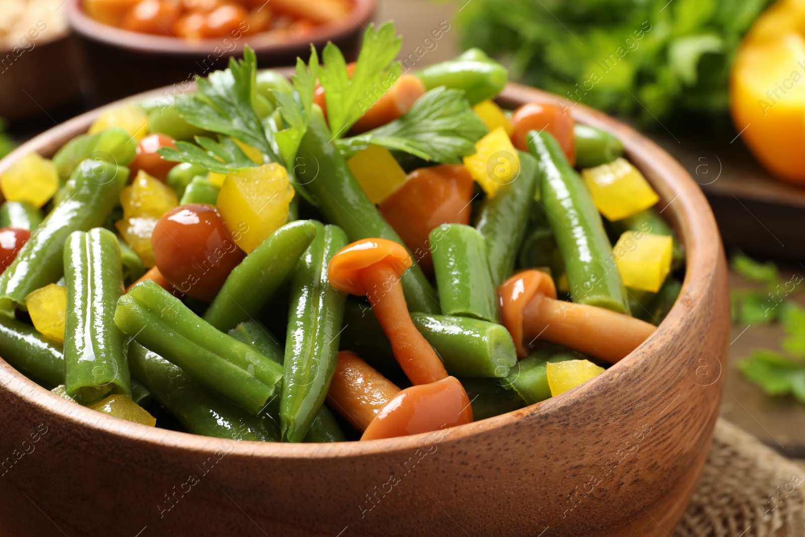 Photo of Bowl of tasty salad with green beans, closeup view